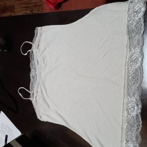 White House Black Market cream color tank top. Adjustable straps,size M